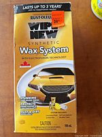 Front of Rust-Oleum Wipe New Synthetic Wax System box showing product branding and 118 mL total volume