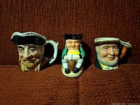 Front view of all three character jugs lined up