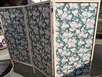 Full view of three-panel room divider standing open