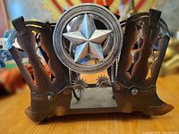 Front view showing cowboy boot cutouts and Texas star medallion