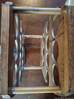 Top view showing curved cut-outs and dowel supports