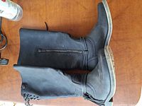 Full view of both boots showing side zipper, laces and uppers