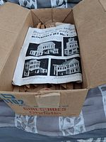 closed cardboard box opened to show contents and Blockitect Set No.3 instruction sheet on top