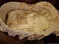 Top view showing basket interior, liner, bedding and worn handles