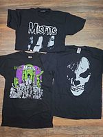 All three Misfits T-shirts laid flat showing front graphics