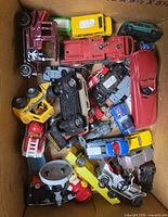 Top view of loose toy vehicles in box