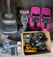 Top view of all RC vehicles and box of parts