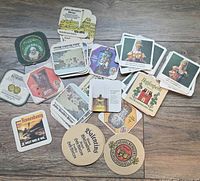 Overview of assorted coasters spread on floor showing variety