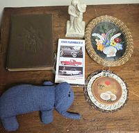 Lot overview with VHS, stash box, elephant, shell wall art, figurine