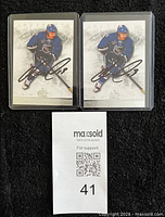 Both autographed cards in top loaders with lot slip