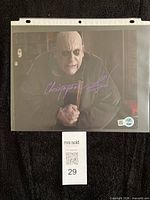 Front view of autographed 8x10 photo in sleeve