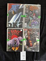 Four comics laid out: DK2, Battle Chasers, The Maxx, X
