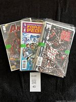 Front view showing three bagged comics including Infinity Man and Brave Old World
