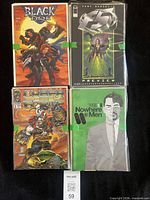 Front view of four comics: Black Tide #1, Image Comics Preview, Cyber Force, Nowhere Men #1