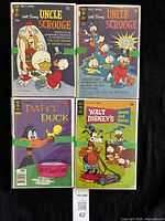 Four key comics laid out showing titles and cover prices