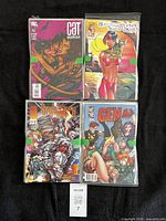 Front view showing four of the bagged comics including Catwoman 78, pink-haired heroine issue, cyborg cover issue and Gen 13