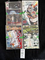 Four comics front covers in sleeves: Moonshadow, Brigade, The Living and the Dead, Moonshadow second cover