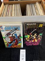 Box filled with bagged comic books