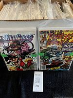 Full short box filled with bagged comics, four sample issues front displayed