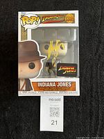 Front view of boxed Indiana Jones Funko Pop showing autograph