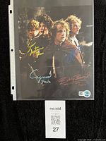 Front view of signed 8x10 photo in sleeve