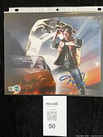 Front view of signed photo showing full image and hologram