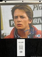 Close view of Michael J. Fox signature in blue ink