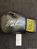 Full view of signed black Everlast glove