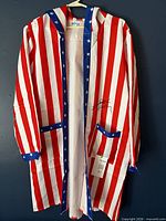 Full robe front view showing stripes, star trim, autograph and COA tag