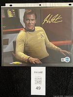 Full view of signed 8x10 photo in sleeve