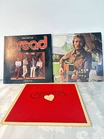 Front covers of all three LPs displayed