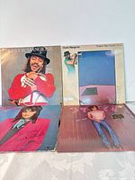 Four LP sleeves displayed together