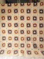 overall view of full crochet afghan hanging