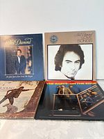 Front covers of all four LPs in lot