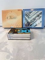 Group view of two CD sets and RadioShack cassette pack