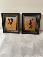 Both framed silhouette prints side by side showing overall condition