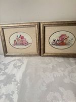Both framed prints side by side
