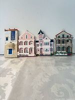 All four wooden house wall pockets lined up
