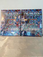 Front view of both sealed hardcover books