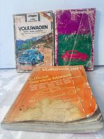 Front view of all three manuals showing covers and wear