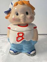 Front view showing complete cookie jar with lid on