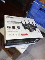 Front of Asus RT-AC5300 router box showing product image and model details