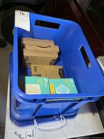 Crate showing sealed AmazonBasics cable boxes and TP-Link router boxes