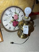 Clock face and converted brass Aladdin lamp with bulb and power cord