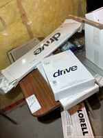 Stacked sealed Drive Medical sling boxes showing logos and model stickers