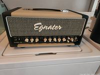 Front view of Egnater Rebel 20 Mark II amplifier head on white surface