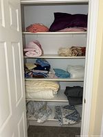 Full closet view showing all shelves of linens