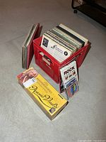 overall view of crate full of LPs, Vivaldi CD box, Rock Guitar item