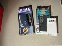 Casio TP-51 and Realistic Micro-29 microcassette recorder boxes side by side
