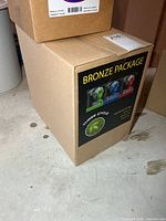 Sealed cardboard box with Bronze Package label